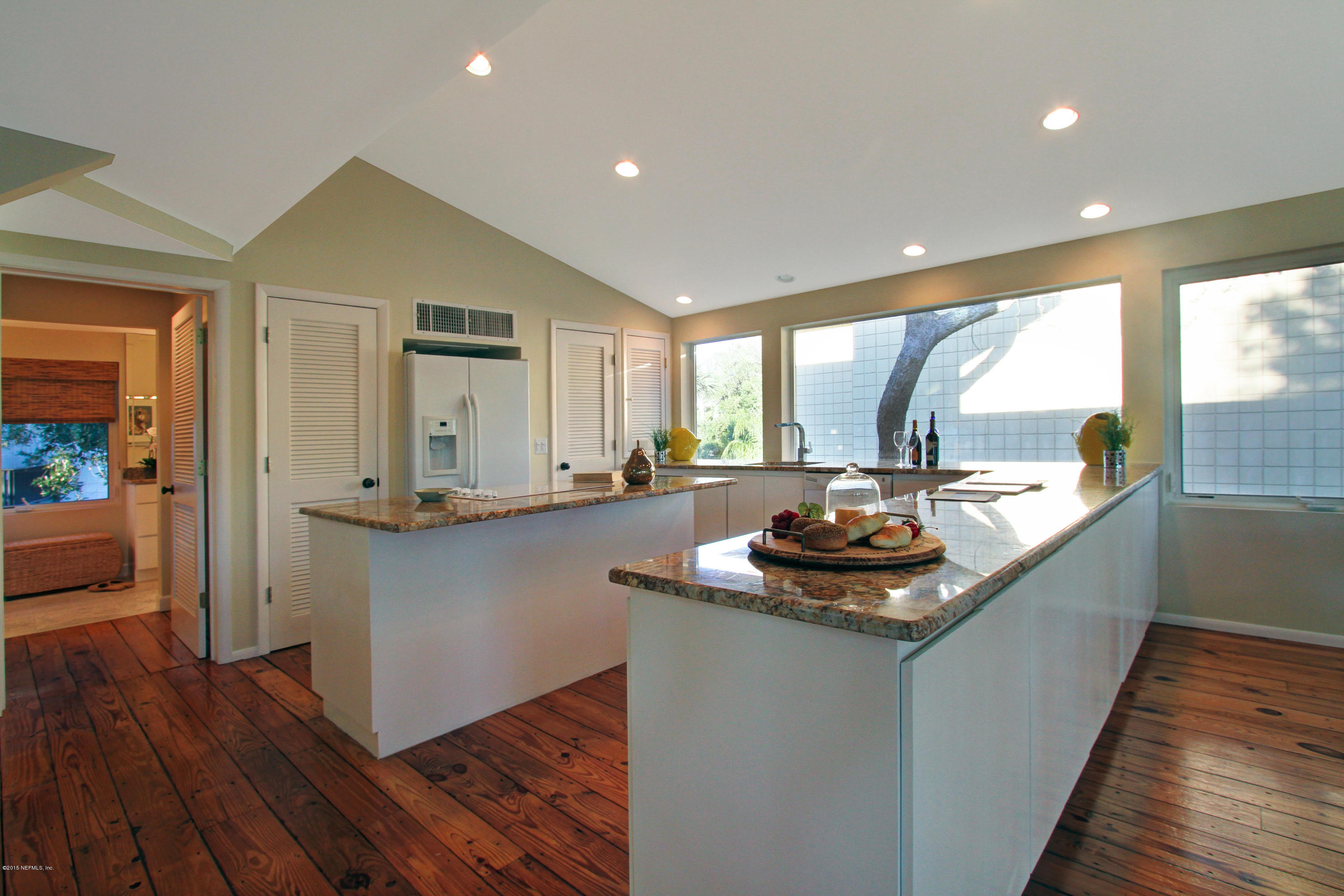 71 19th Street Atlantic Beach, FL 32233 - Photo 17 of 30 a kitchen with a sink and wooden floor