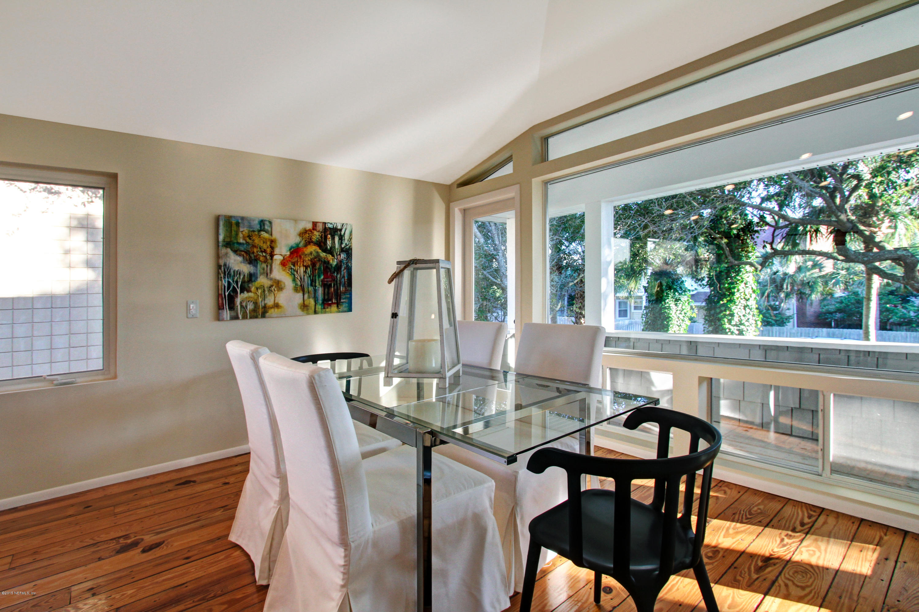 71 19th Street Atlantic Beach, FL 32233 - Photo 18 of 30 a view of a dining room with furniture large window and wooden floor