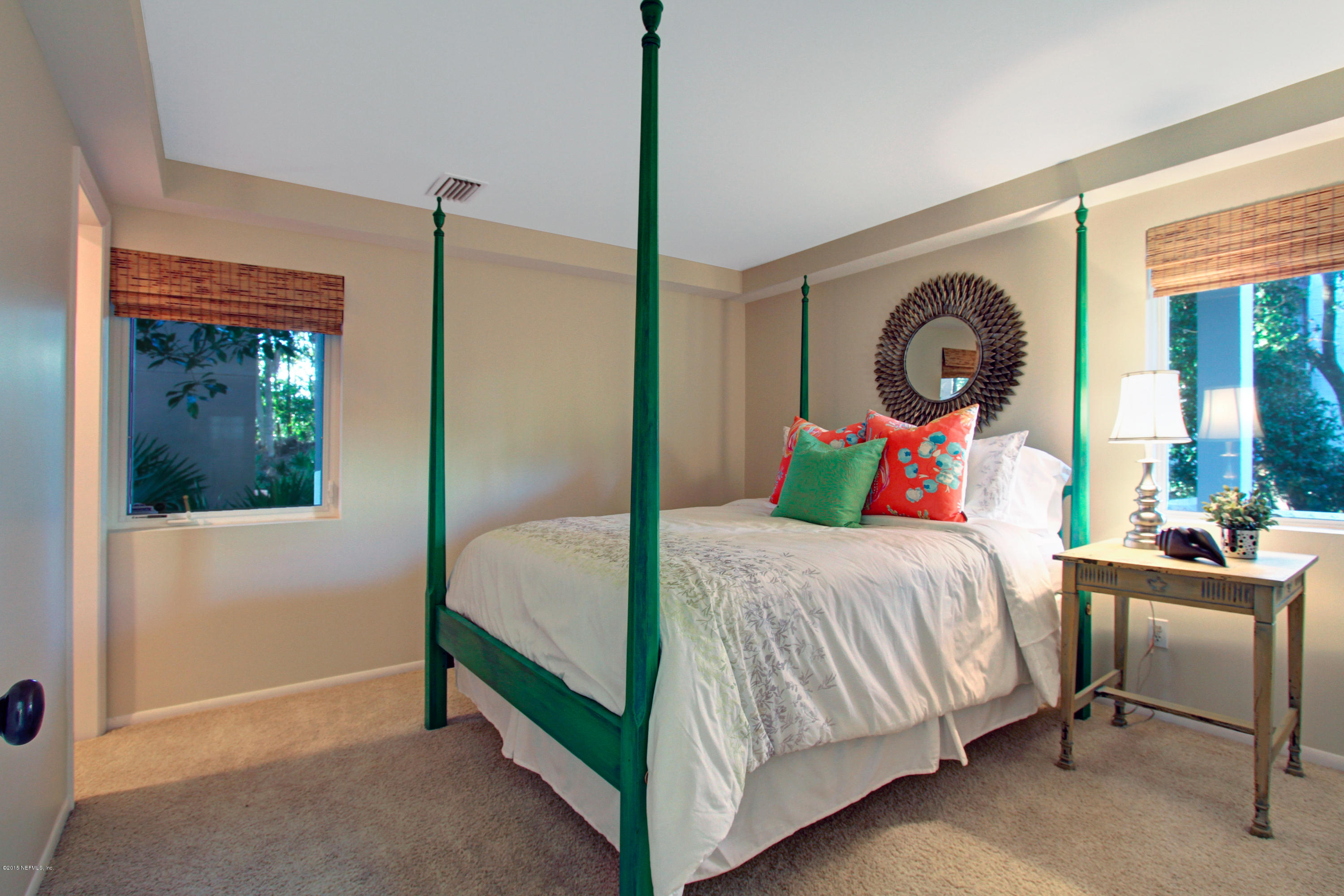 71 19th Street Atlantic Beach, FL 32233 - Photo 23 of 30 a bedroom with a bed and a window