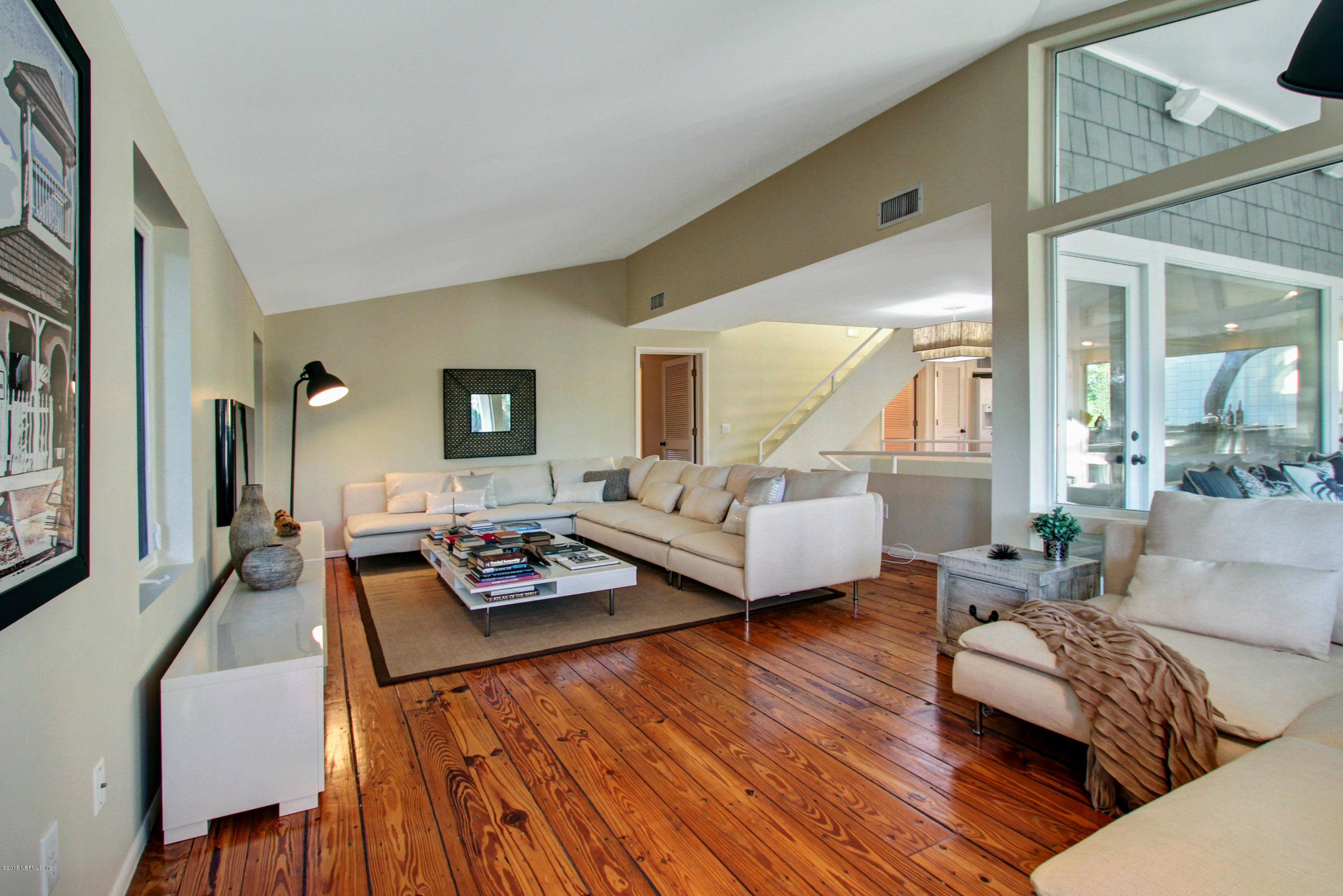71 19th Street Atlantic Beach, FL 32233 - Photo 6 of 30 a living room with furniture and a table