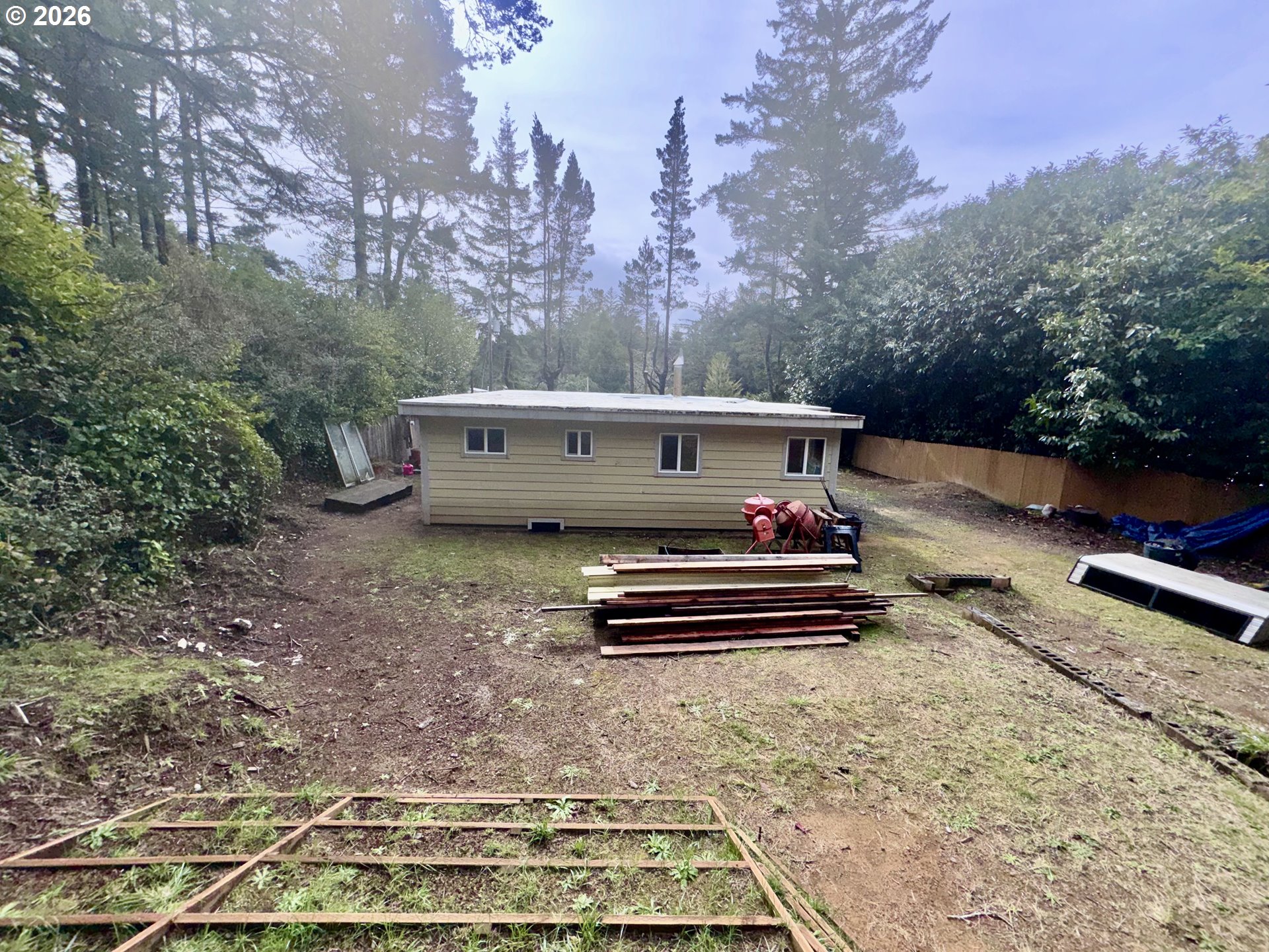 4923 Mitchell Loop Road Florence, OR 97439 - Photo 14 of 22 a view of a park with large trees