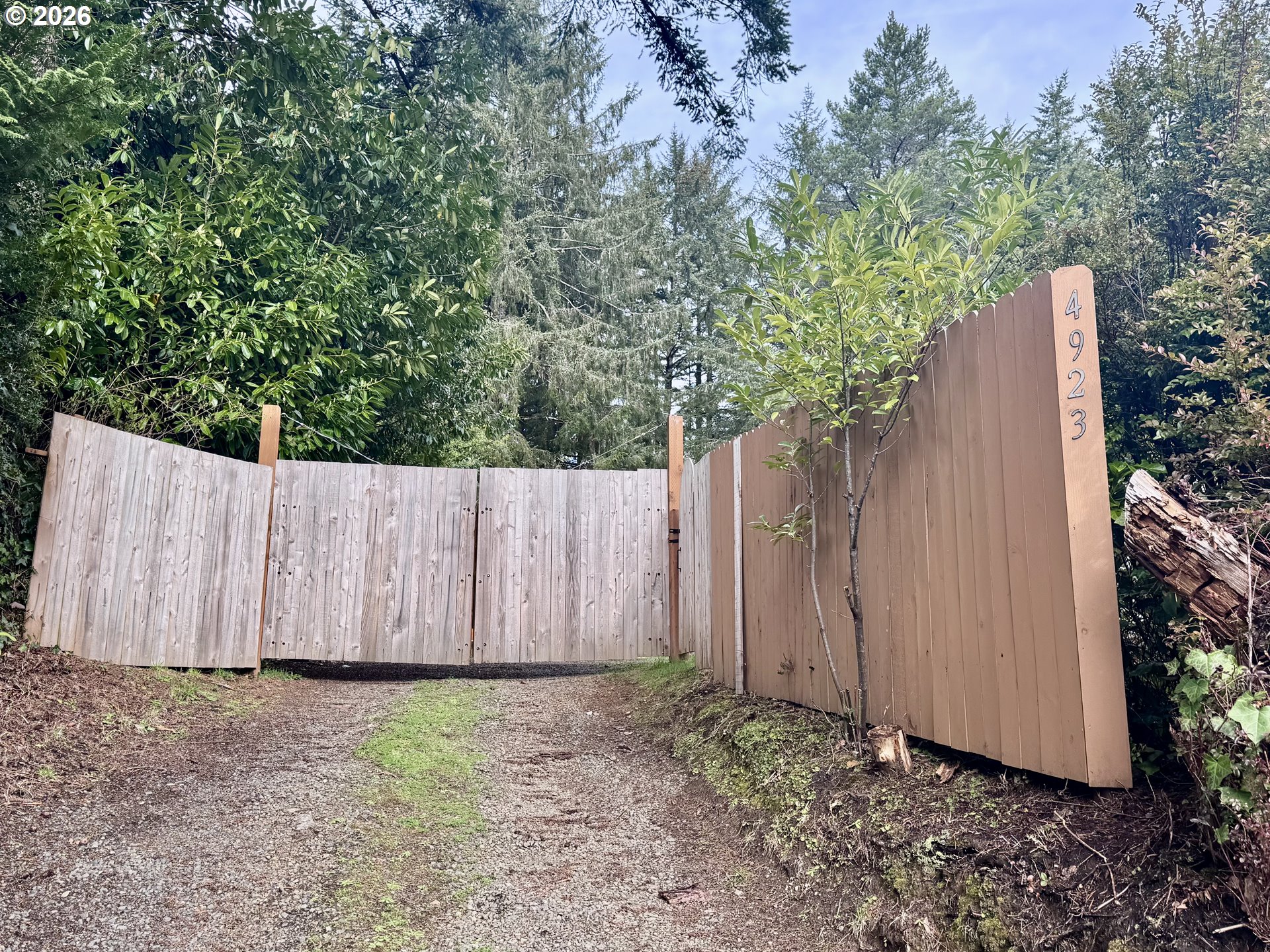 4923 Mitchell Loop Road Florence, OR 97439 - Photo 22 of 22 a backyard of a house