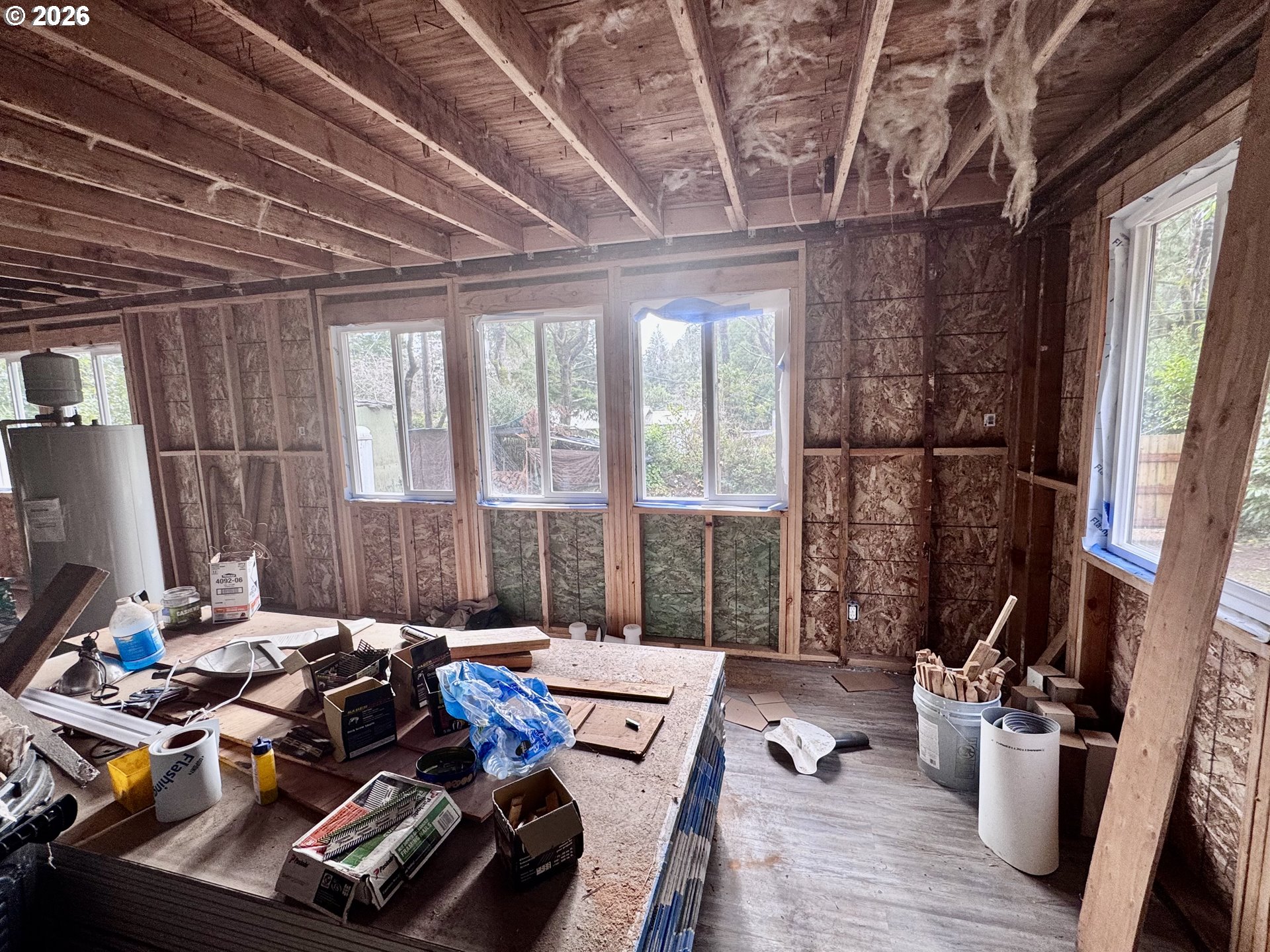 4923 Mitchell Loop Road Florence, OR 97439 - Photo 9 of 22 a bed room with furniture and a window