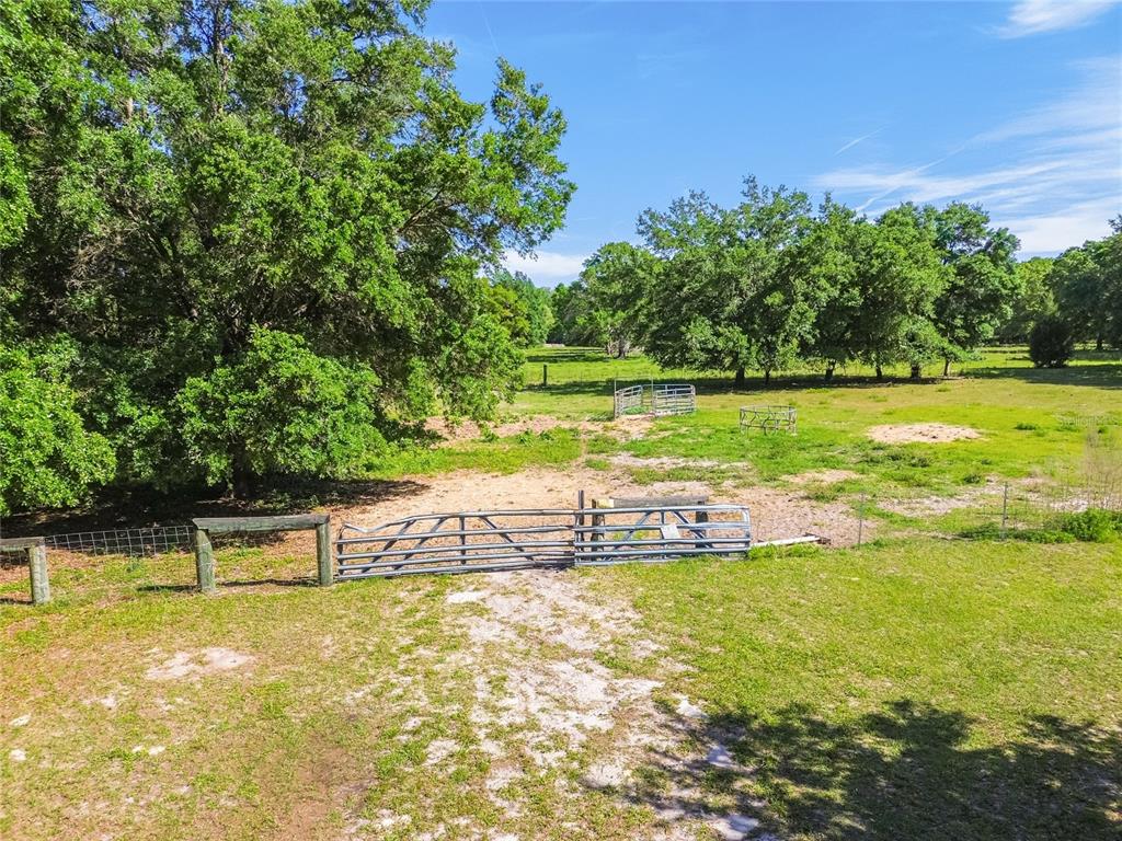 12500 Hamlin Road Spring Hill, FL 34610 - Photo 38 of 82 a view of a swimming pool with an outdoor space and seating area
