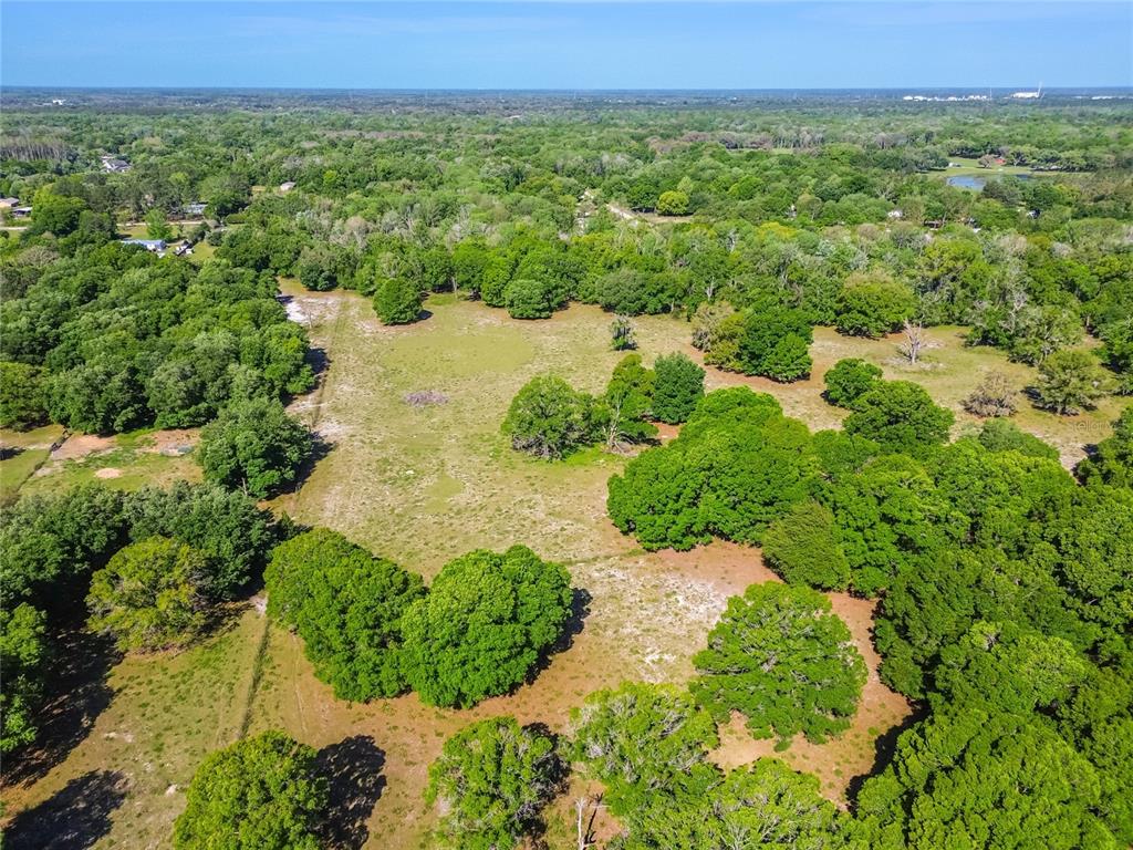 12500 Hamlin Road Spring Hill, FL 34610 - Photo 41 of 82 an aerial view of a house with a yard