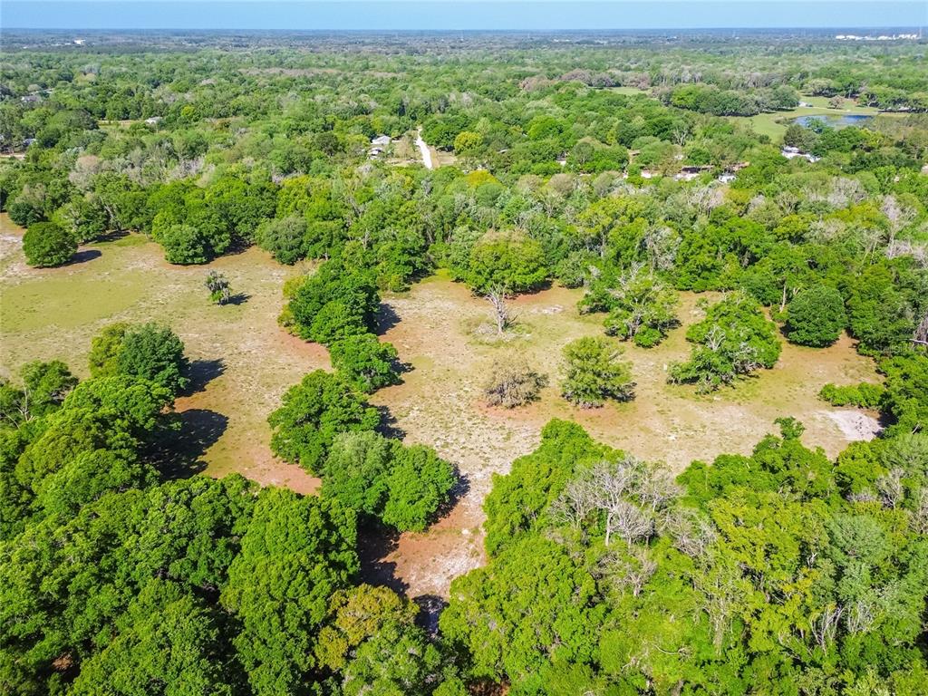 12500 Hamlin Road Spring Hill, FL 34610 - Photo 43 of 82 a view of a lake with a yard
