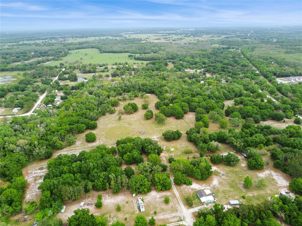 12500 Hamlin Road Spring Hill, FL 34610 - Photo 77 of 82 a view of a city with lush green forest