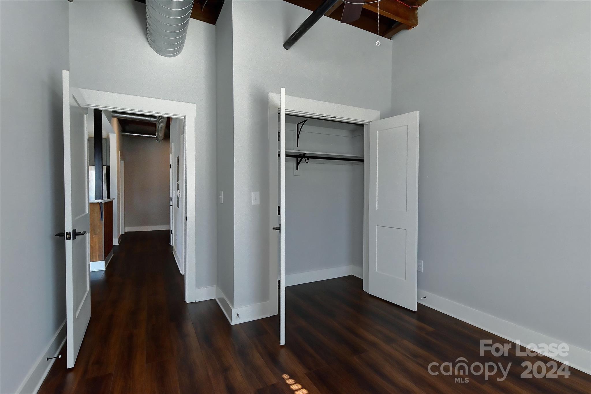 115 South Main Street, Unit 202 Monroe, NC 28112 - Photo 13 of 25 wooden floor in an empty room