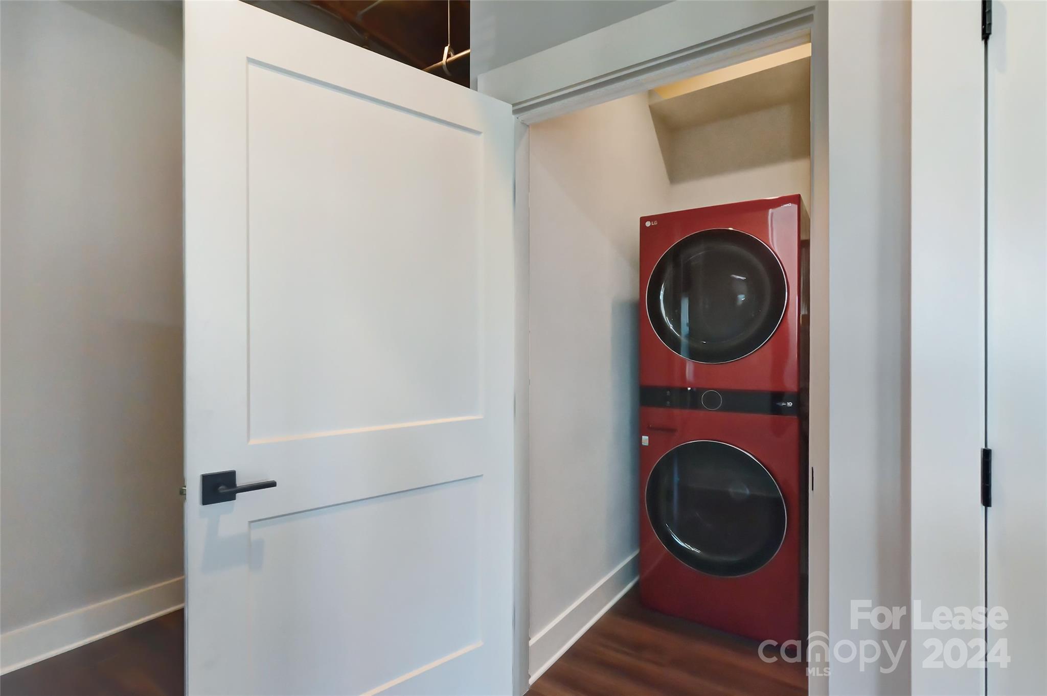 115 South Main Street, Unit 202 Monroe, NC 28112 - Photo 17 of 25 a view of a hallway with washer and dryer