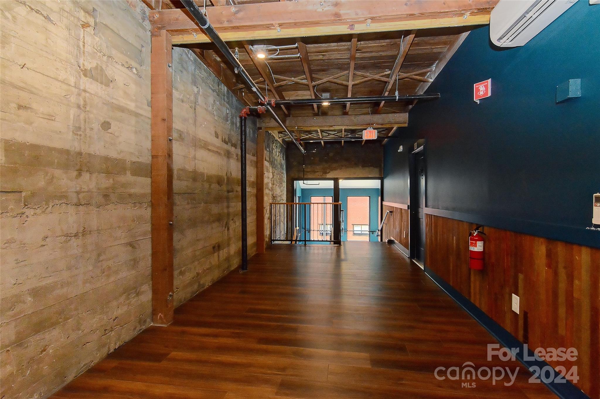 115 South Main Street, Unit 202 Monroe, NC 28112 - Photo 19 of 25 a view of gallery with wooden floor