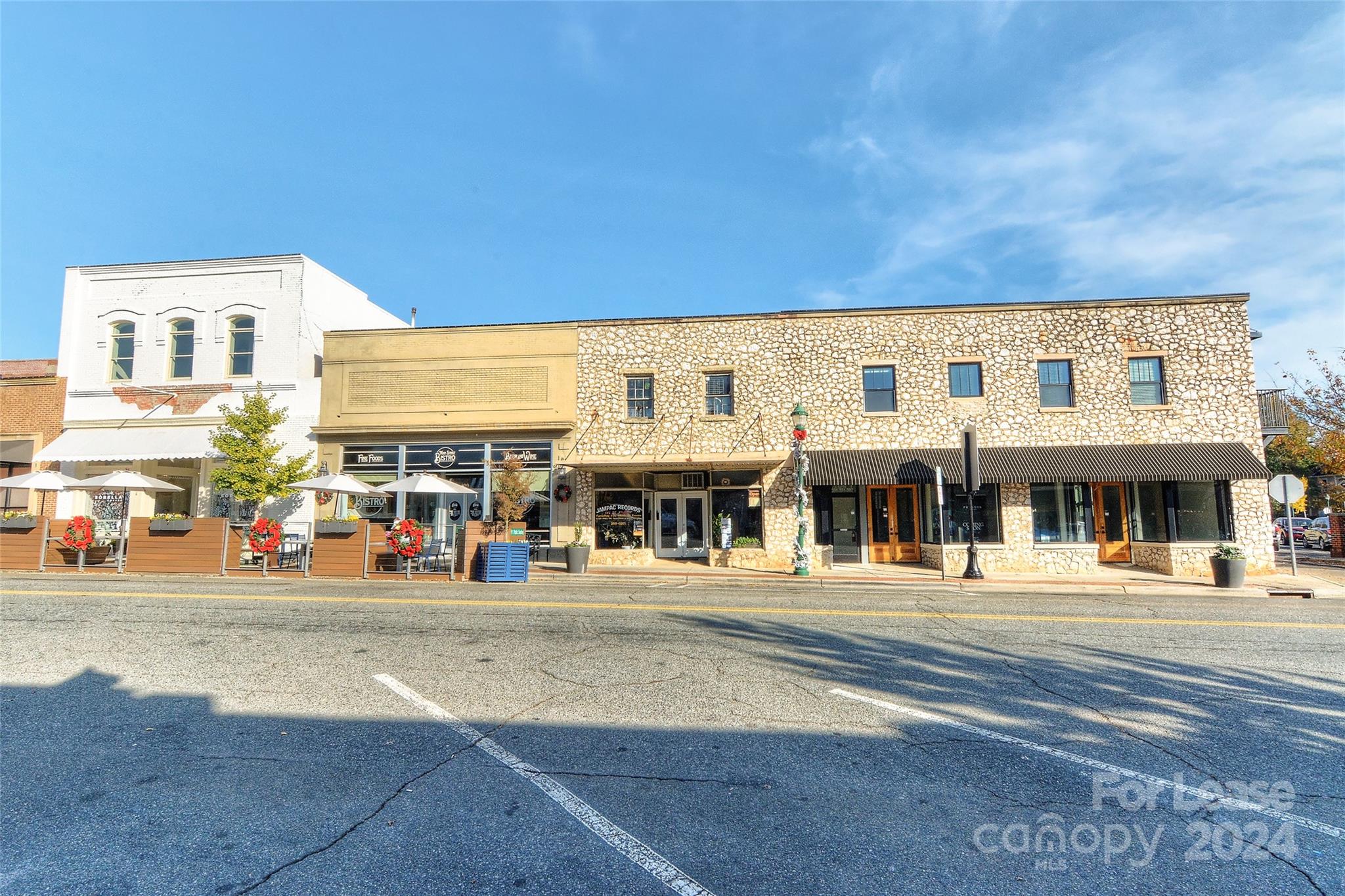115 South Main Street, Unit 202 Monroe, NC 28112 - Photo 20 of 25 a front view of a building with streets and trees