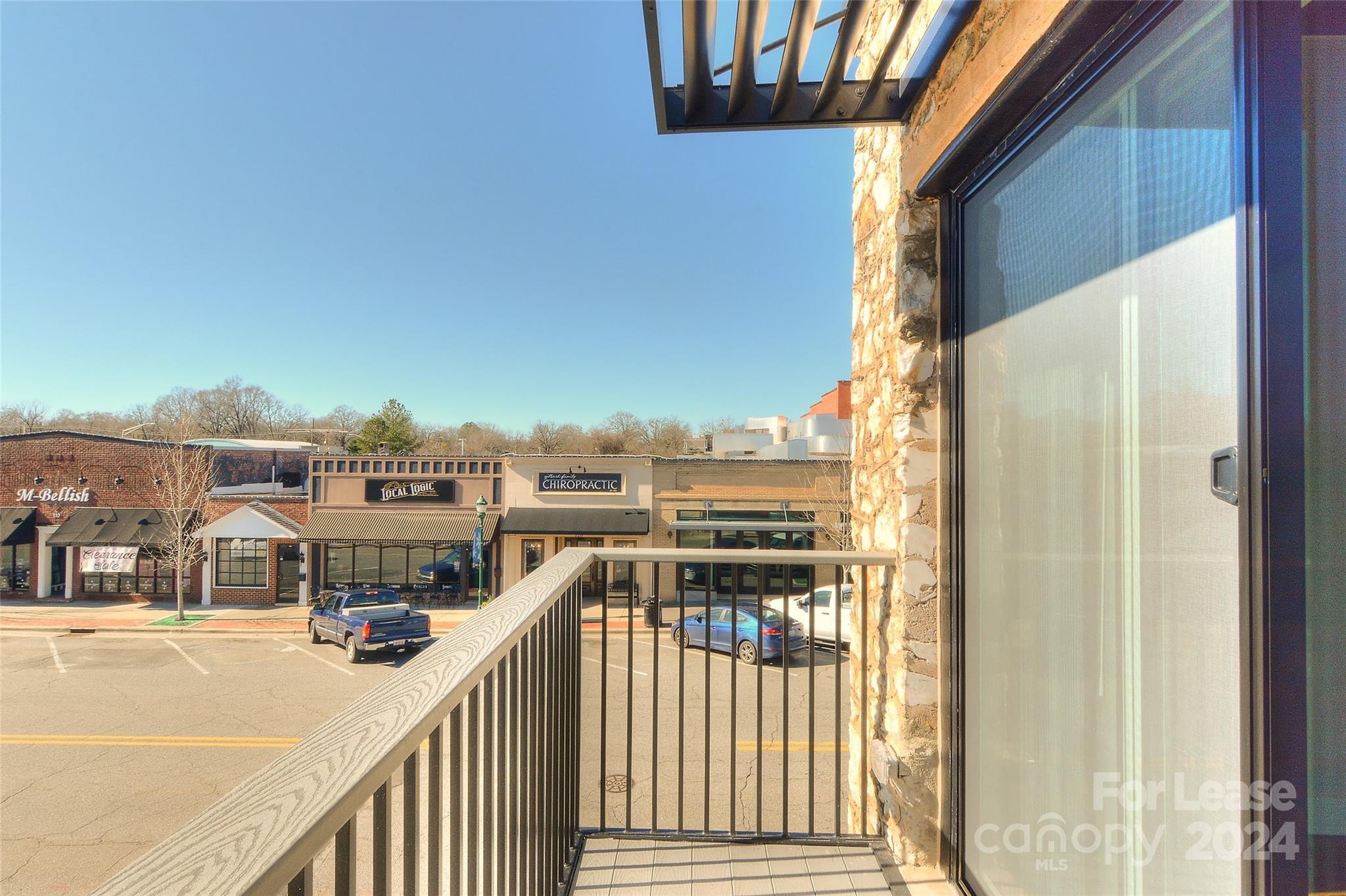 115 South Main Street, Unit 202 Monroe, NC 28112 - Photo 2 of 25 a view of a balcony with city view