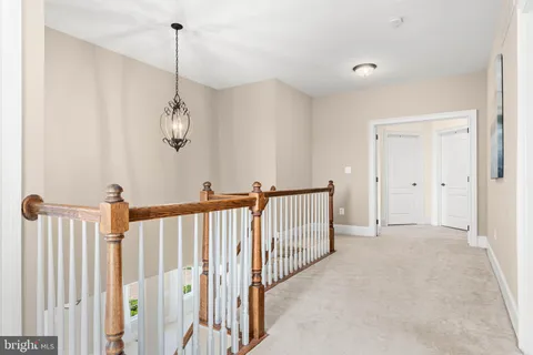 a view of a hallway with a chandelier