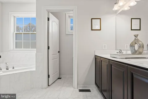 a bathroom with a bathtub and a sink