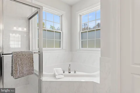 a bathroom with a bathtub and a sink