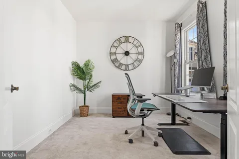 a view of a room with a table and a chair