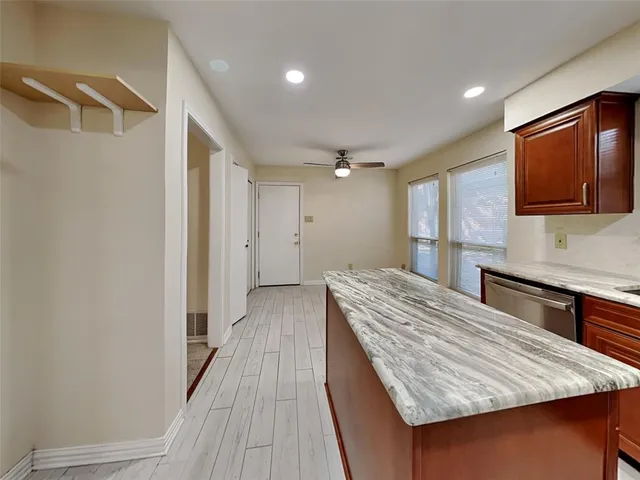 a bedroom with a bed and a television