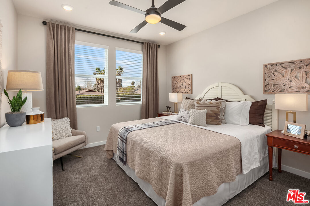 170 Tarragon Way Upland, CA 91786 - Photo 8 of 17 a spacious bedroom with a bed a chandelier and a large window