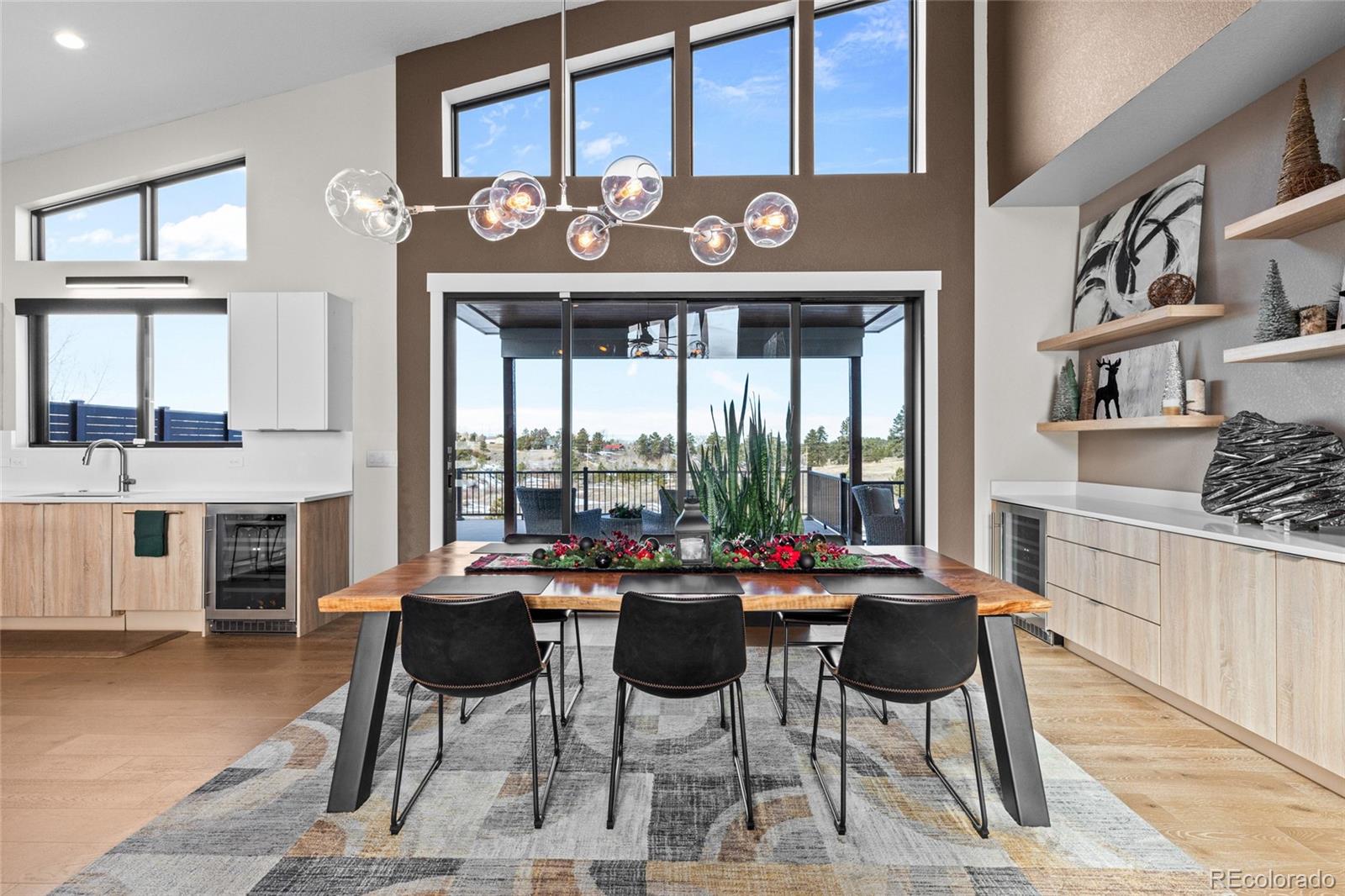 10205 Inspiration Drive Parker, CO 80138 - Photo 13 of 50 a view of a dining room with furniture window and wooden floor