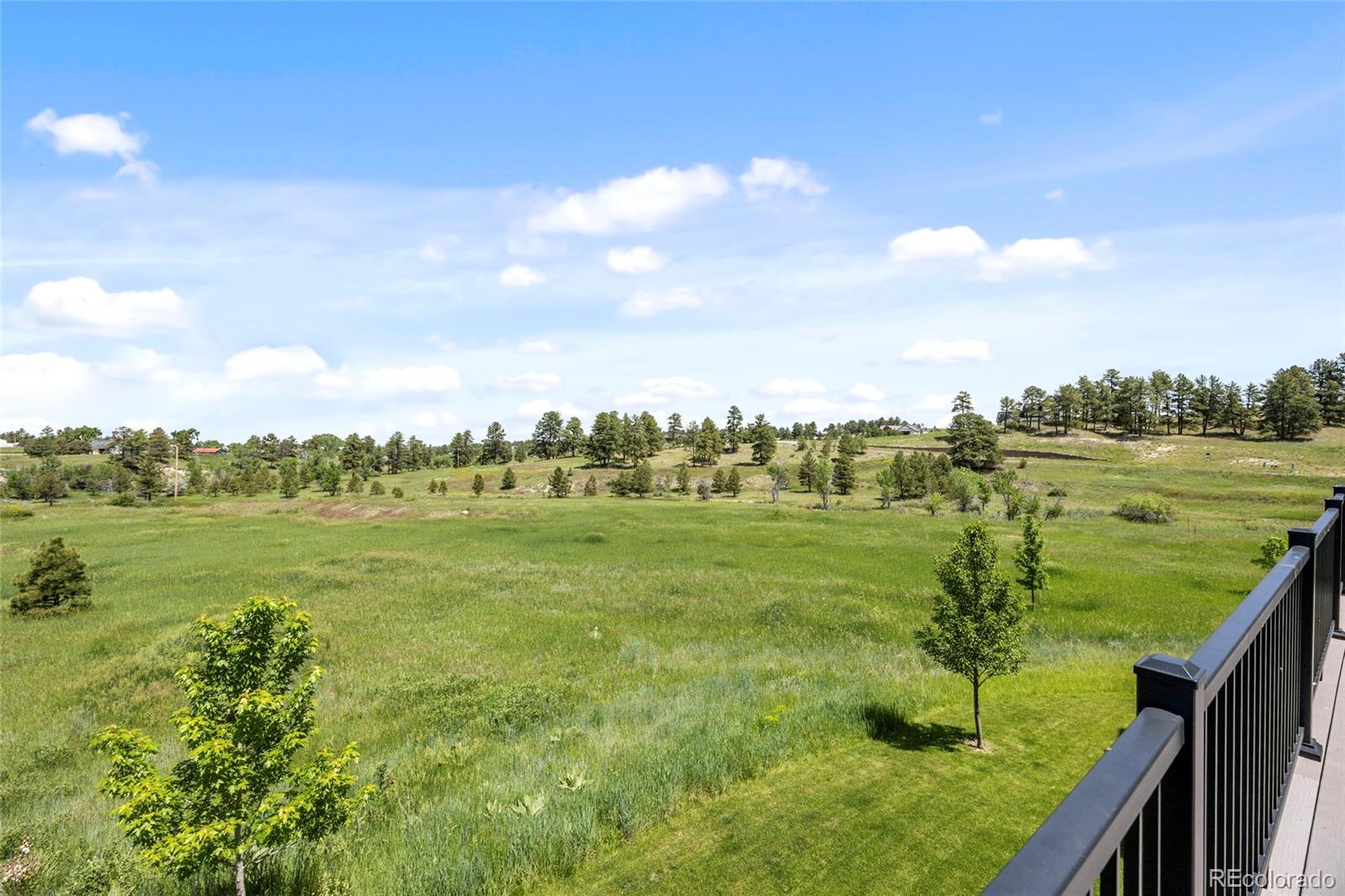 10205 Inspiration Drive Parker, CO 80138 - Photo 24 of 50 a view of an ocean from a balcony