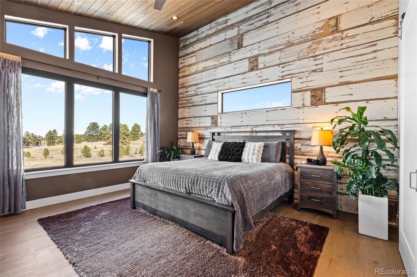 10205 Inspiration Drive Parker, CO 80138 - Photo 25 of 50 a bed sitting in a bedroom next to a window