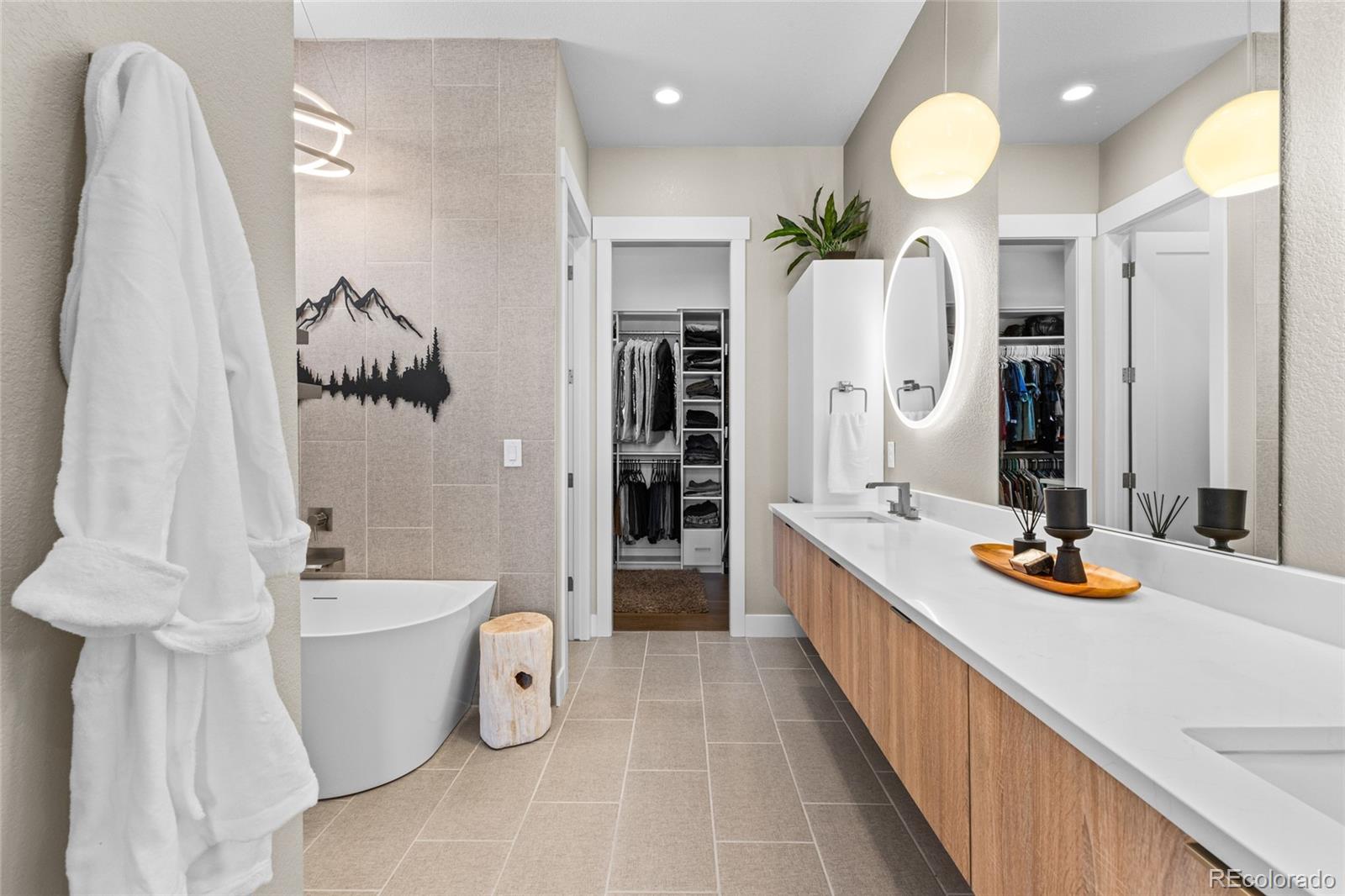 10205 Inspiration Drive Parker, CO 80138 - Photo 27 of 50 a bathroom with a bathtub sink and toilet