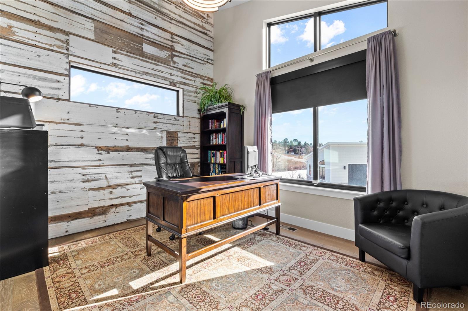 10205 Inspiration Drive Parker, CO 80138 - Photo 32 of 50 a living room with a couch and a large window