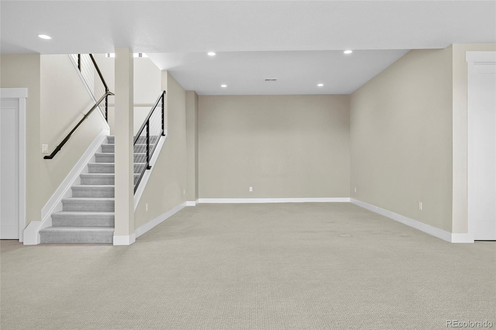 10205 Inspiration Drive Parker, CO 80138 - Photo 36 of 50 a view of an empty room with stairs