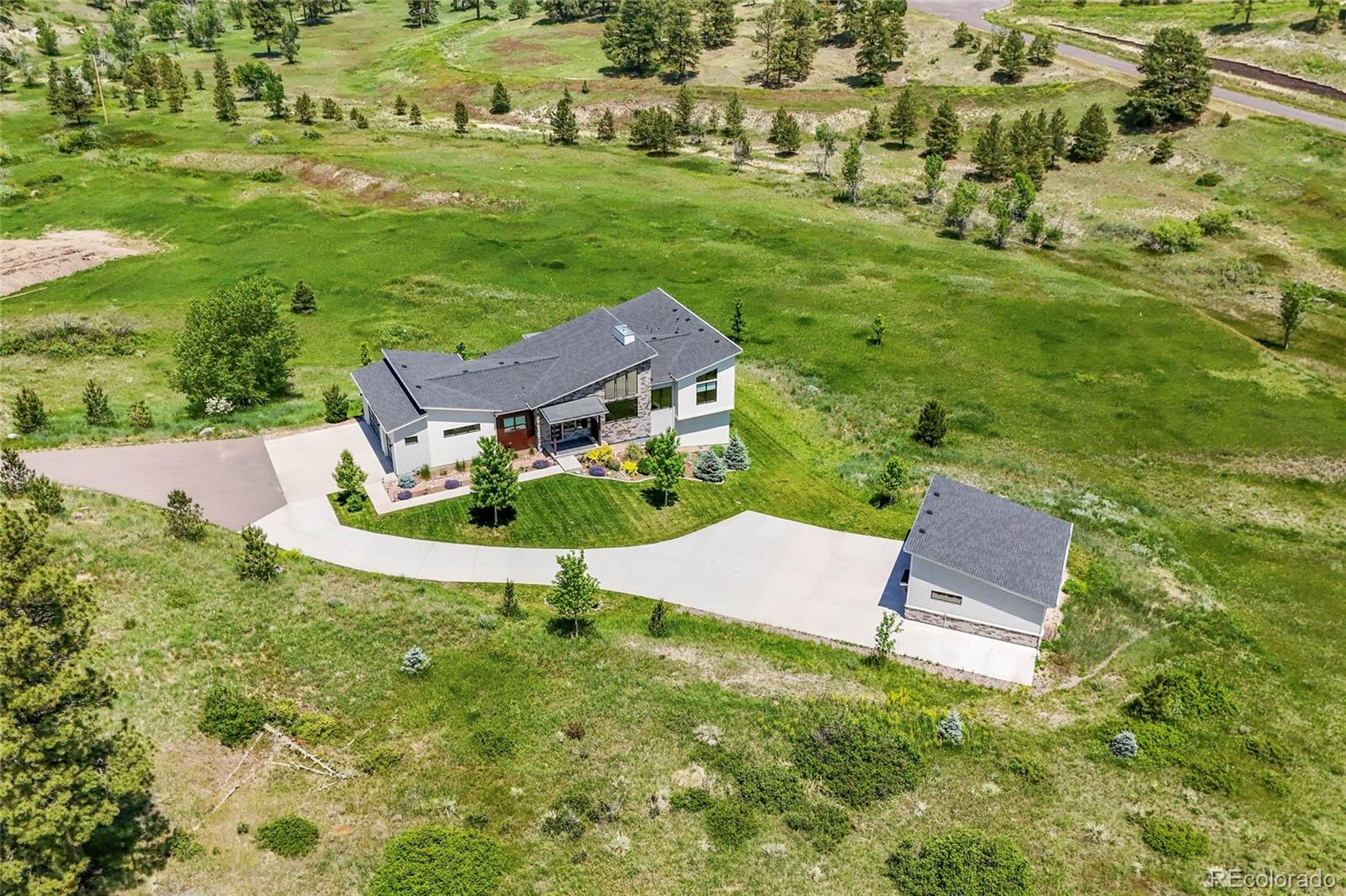 10205 Inspiration Drive Parker, CO 80138 - Photo 4 of 50 an aerial view of a house with a garden