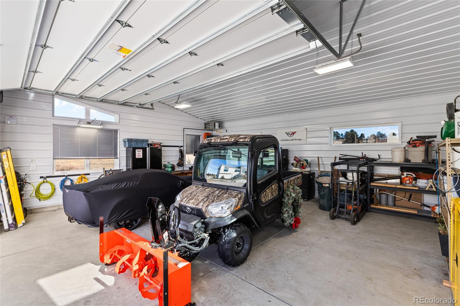 10205 Inspiration Drive Parker, CO 80138 - Photo 41 of 50 a bedroom with furniture and a projector