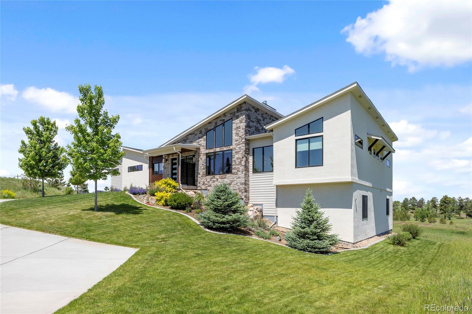 10205 Inspiration Drive Parker, CO 80138 - Photo 45 of 50 a front view of a house with a yard