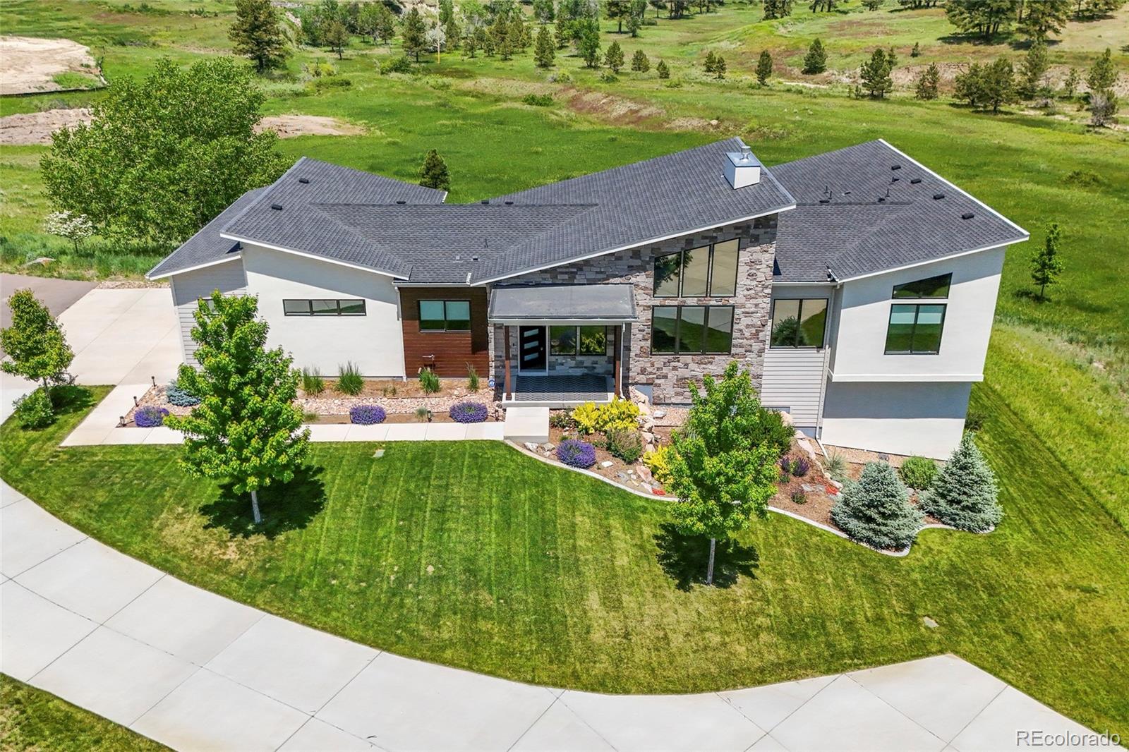 10205 Inspiration Drive Parker, CO 80138 - Photo 47 of 50 a aerial view of a house with garden