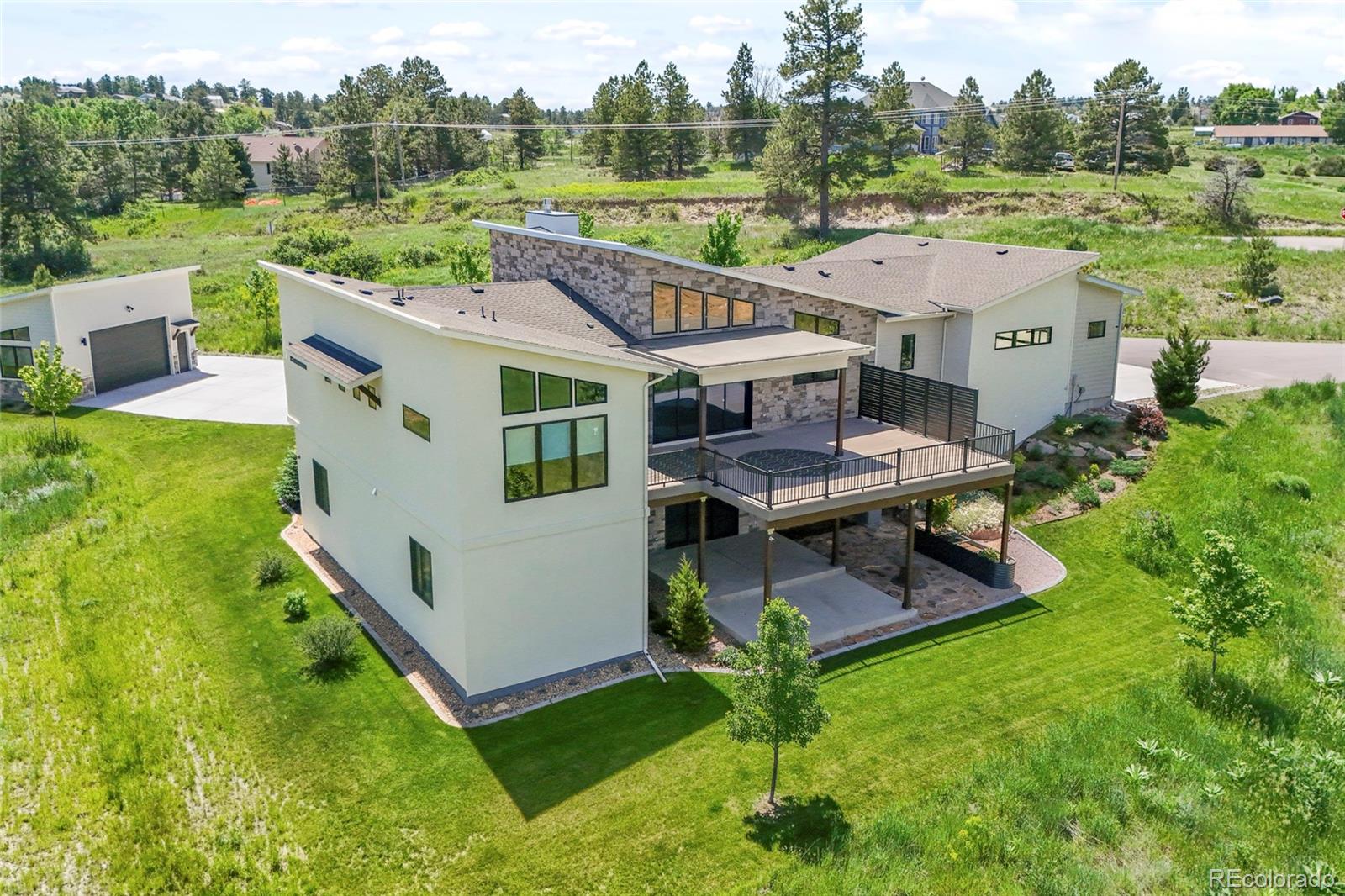 10205 Inspiration Drive Parker, CO 80138 - Photo 48 of 50 an aerial view of a house with pool table and chairs