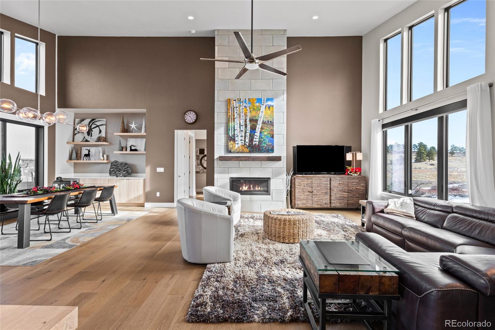 10205 Inspiration Drive Parker, CO 80138 - Photo 8 of 50 a living room with furniture fireplace and flat screen tv