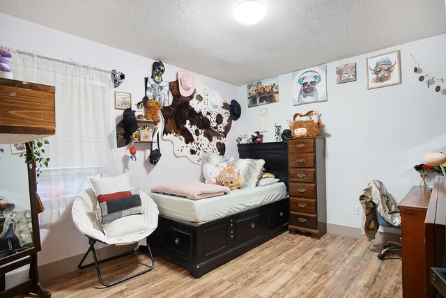 a bedroom with furniture and a bed