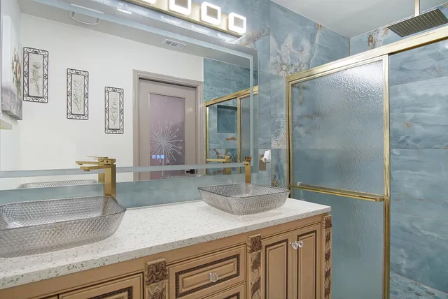 a bathroom with a sink and a mirror