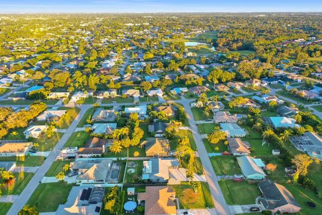 an aerial view of residential houses with outdoor space