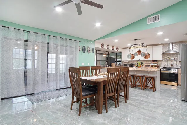 a view of a dining room with furniture