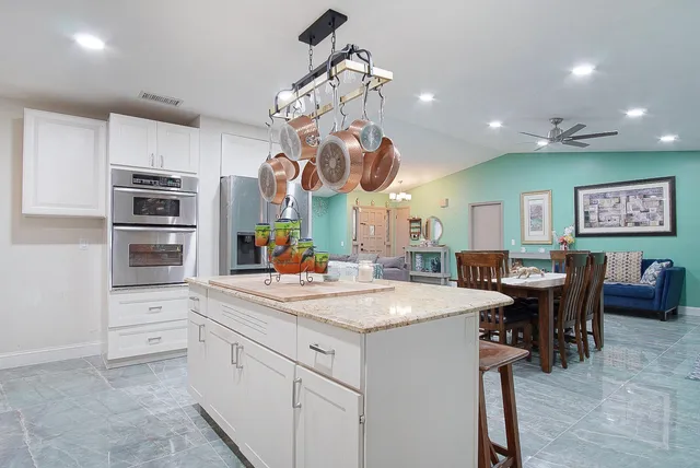 a kitchen with a table and chairs in it