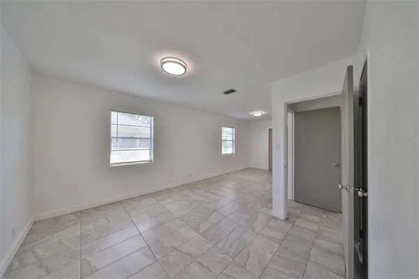a view of an empty room and window