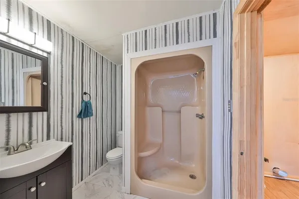 a view of a hallway with a washer and dryer