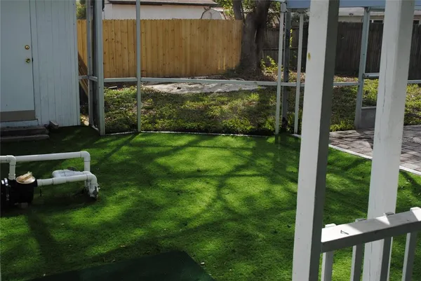 a view of a backyard with a car parked