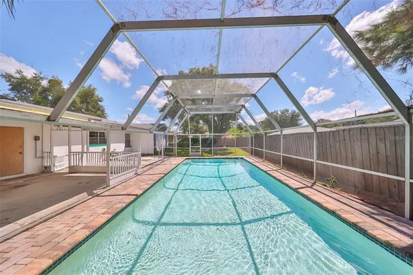 a view of a backyard with a patio