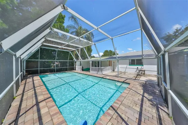 a view of a backyard with sitting area
