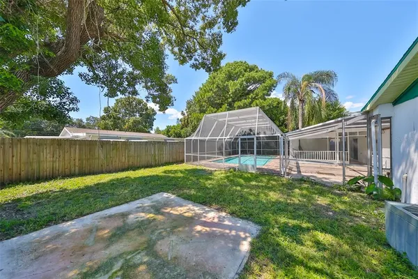 a view of a back yard with green space