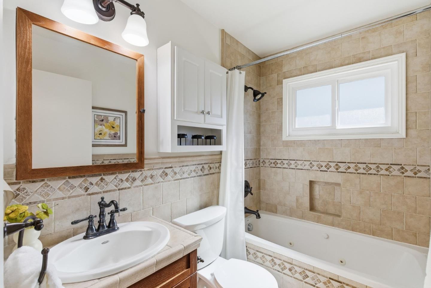 1345 Tuolumne Road Millbrae, CA 94030 - Photo 11 of 44 a bathroom with a sink toilet and shower