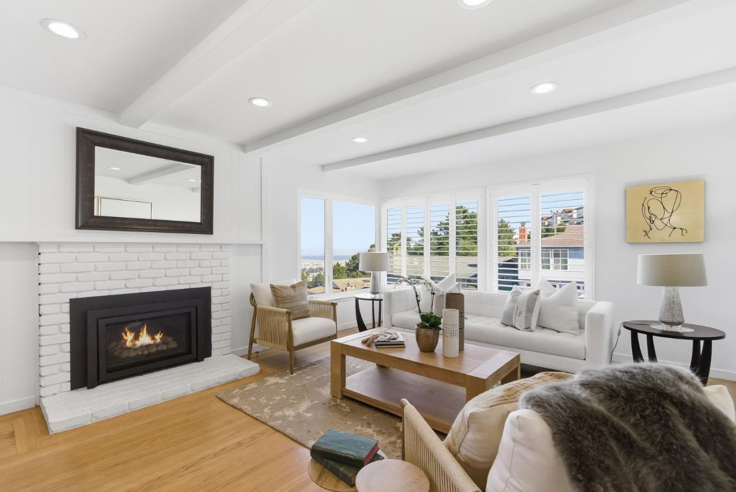 1345 Tuolumne Road Millbrae, CA 94030 - Photo 15 of 44 a living room with furniture large window and a fireplace