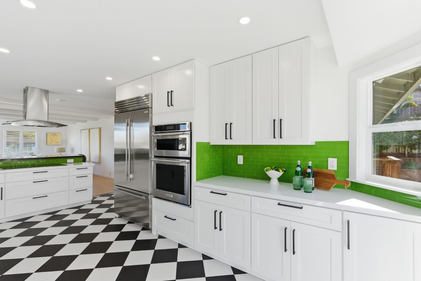 1345 Tuolumne Road Millbrae, CA 94030 - Photo 24 of 44 a kitchen with a sink a microwave a stove and refrigerator