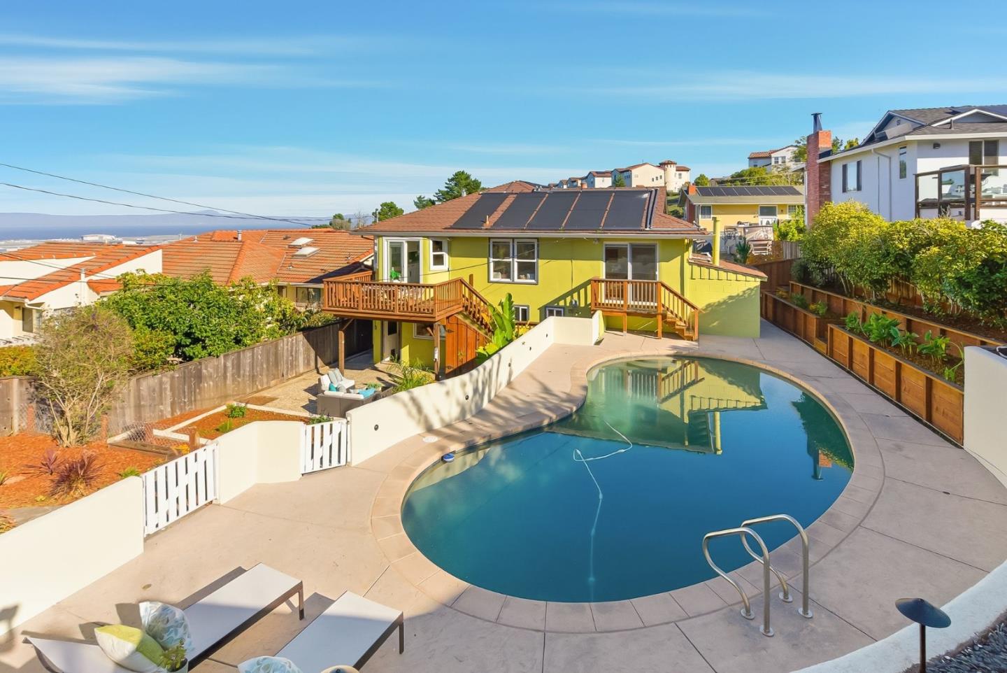 1345 Tuolumne Road Millbrae, CA 94030 - Photo 41 of 44 a view of a swimming pool with a lounge chairs