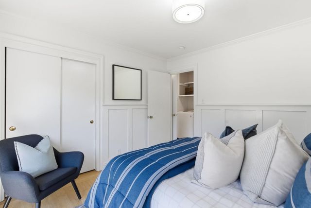 a bedroom with furniture and a couch